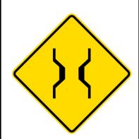 Yellow diamond-shaped road sign indicating a winding road ahead — This image shows a yellow diamond-shaped warning sign indicating a winding road ahead.